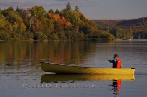 Photo: Woman Canoeing Rock Lake Ontario Canada