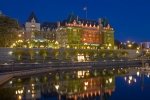 A calm evening reveals reflections of the grand and elegant Empress Hotel, situated along the waterfront  in the inner harbour of Victoria - the beautiful capital city of British Columbia, Canada.