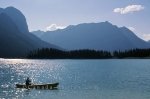 Canoe on a beautiful lake with mountains in the Peter Lougheed Provincial Park in the Kananaski Country of Alberta in Canada.