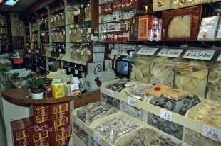 A market in Chinatown in Toronto, Ontario has shelves full of dried goods that are needed for mastering some Asian recipes.