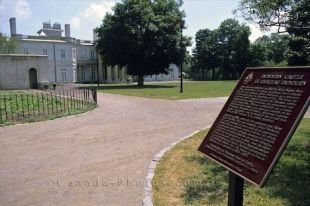 An information sign and the pathways leading to the Dundurn Castle in downtown Hamilton in Ontario, Canada.