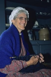 A lady knitting in her home in the historic Upper Canada Village in Morrisburg, Ontario, in Canada.