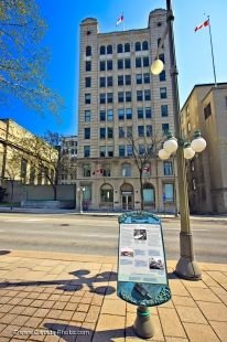 A sign across the street from the National Press Building in the City of Ottawa, Ontario in Canada explains the details of this historic building.