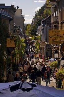Tourists line the Rue du Petite-Champlain in Quartier Petite Champlain in Old Quebec, Canada during the warm summer days.