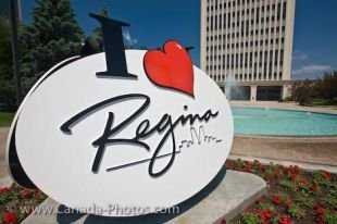 A decorative sign has been erected in the Queen Elizbeth II Court gardens outside City Hall in the City of Regina in Saskatchewan, Canada.