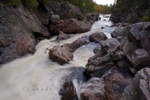The banks of the Sand River in Lake Superior Provincial Park in Ontario, are adorned with rocks as the river marks its path between them.